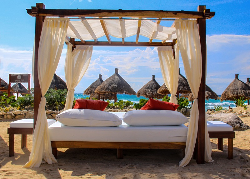 beach lounge bed and umbrellas 